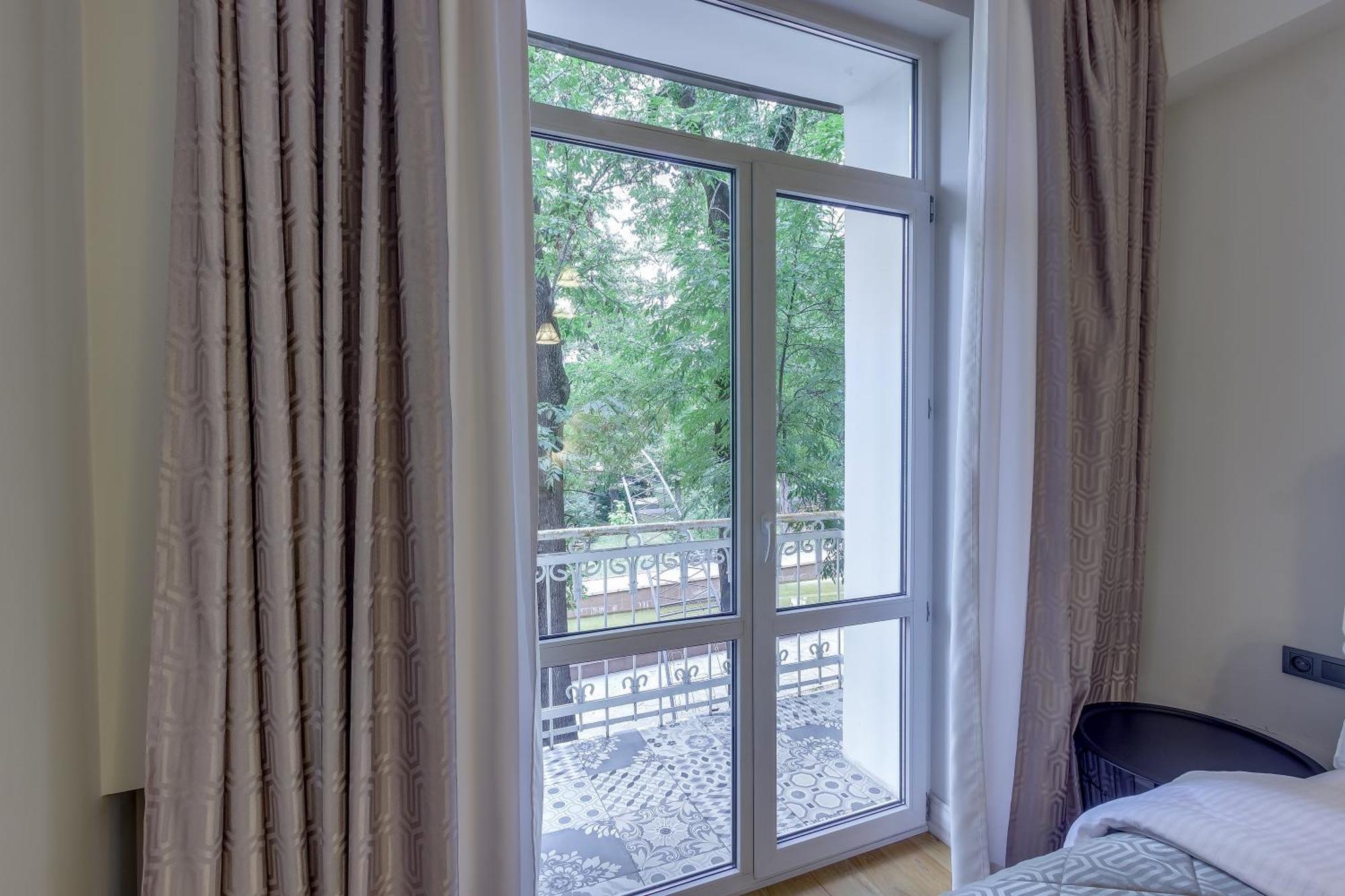 Opera Apartments Алма Ата Стая снимка